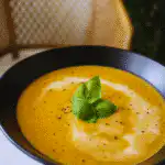 : creamy roasted veggie soup in rustic setting