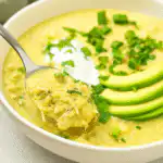 Green Enchiladas Chicken Soup in a Bowl with Toppings