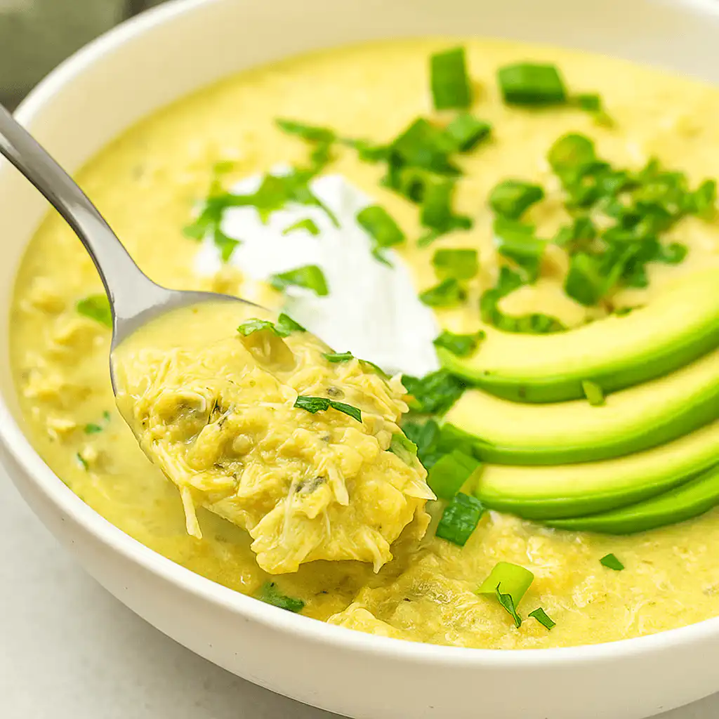 Green Enchiladas Chicken Soup in a Bowl with Toppings