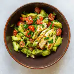 Healthy Avocado Chicken Salad in a bowl with fresh ingredients