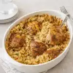 Chicken Thighs and Rice in skillet with garlic rice