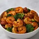 High-Protein Honey Garlic Shrimp plated with garnish