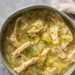 One Pot Lemon Dilly Chicken Rice Soup in rustic bowl