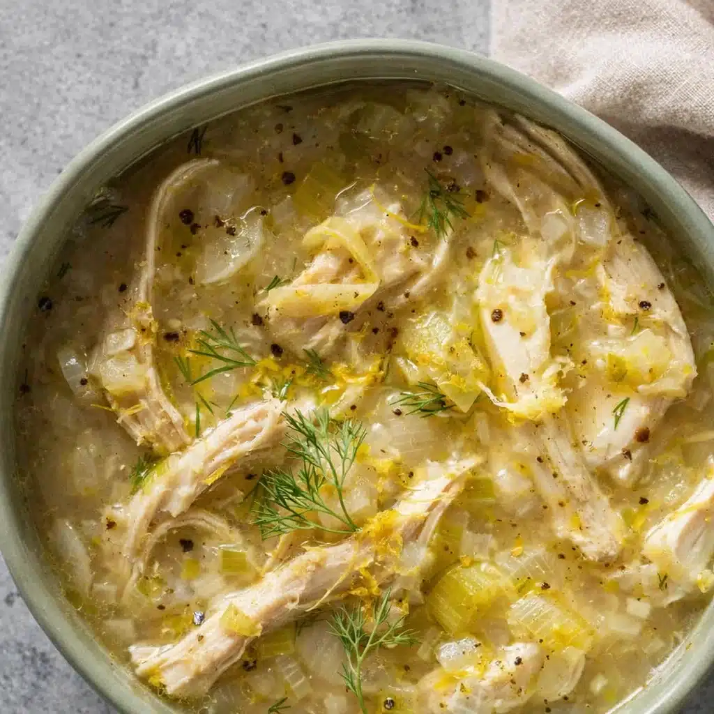 One Pot Lemon Dilly Chicken Rice Soup in rustic bowl