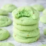 freshly baked pistachio pudding cookies on a baking tray