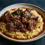 Slow-Braised Pot Roast with Risotto on rustic plate