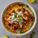Street Corn Chicken Rice Bowl served with Cotija and lime