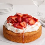 Gluten Free Strawberry Shortcake topped with whipped cream and strawberries