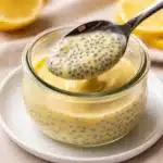 Lemon Cream Chia Pudding in a jar with lemon zest and berries