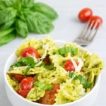 Pesto Pasta with Grilled Chicken served with basil and tomatoes