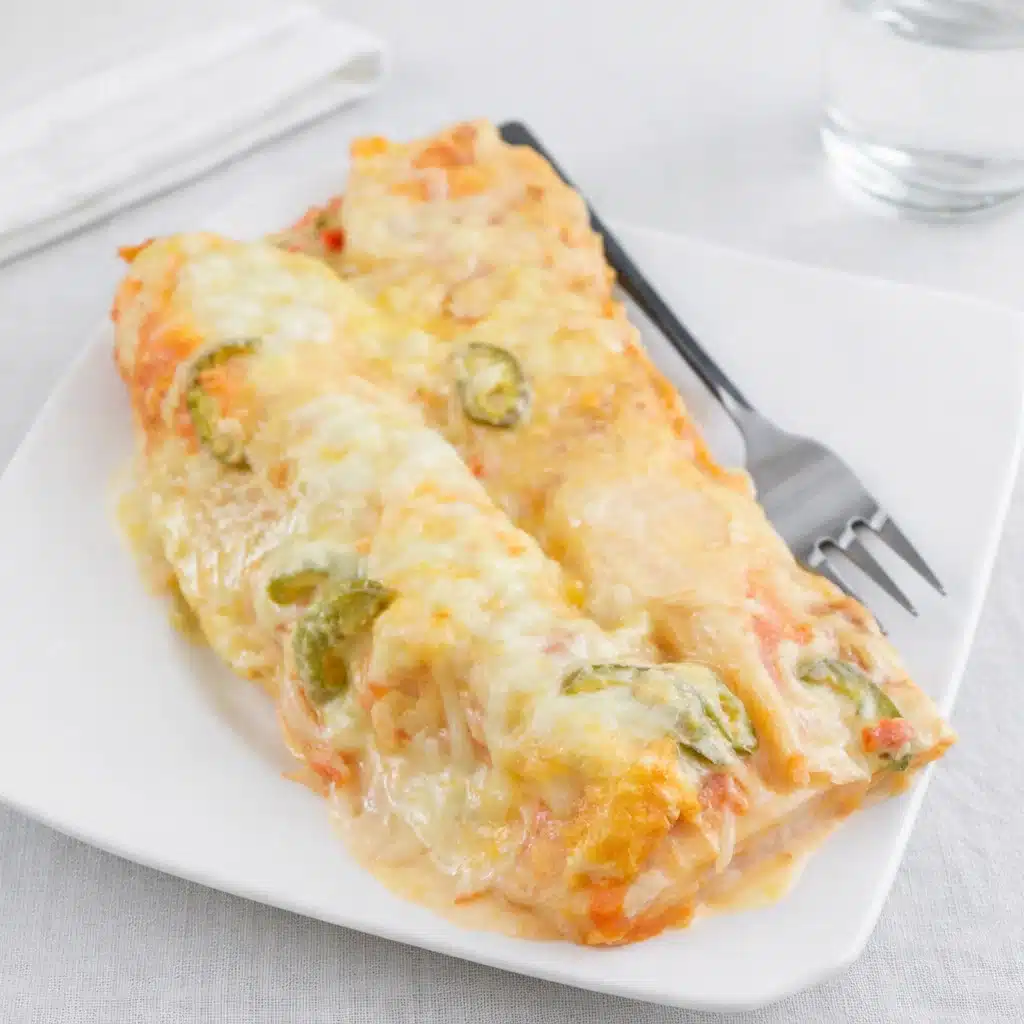 Shrimp Enchiladas Recipe with Creamy Sauce and Melted Cheese