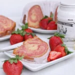 Strawberry Cream Cheese Pound Cake with glaze and fresh strawberries