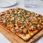 BBQ Chicken Flatbread Pizza with melted cheese and cilantro