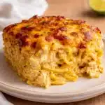 Creamy Chicken Spaghetti Bake with melted cheese pull