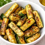Perfect golden-brown Easy Grilled Blackstone Zucchini on a flat top grill.