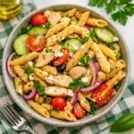 A vibrant bowl of Greek Chicken Pasta Salad with grilled chicken and feta.